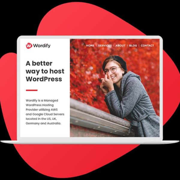 A laptop displays the Wordify website, featuring a woman in glasses and a beanie smiling against an autumn background, with text promoting WordPress hosting services.